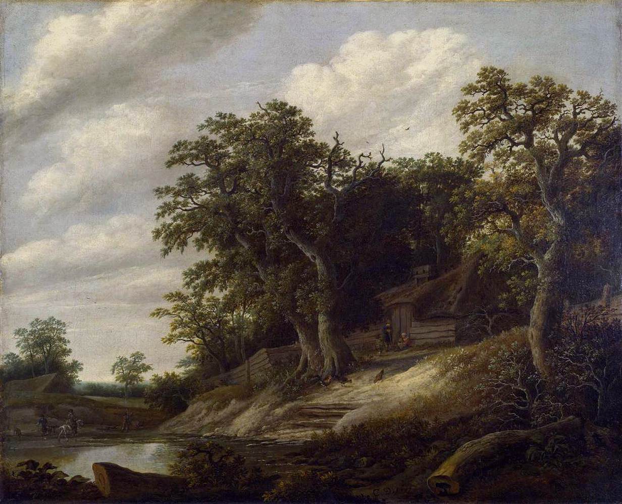 Cottage parmi les arbres sur la rive d'un ruisseau