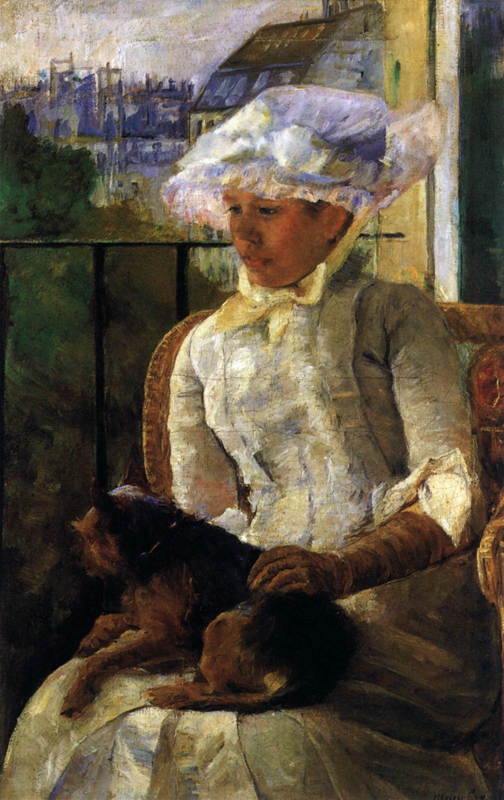 Susan sur un balcon tenant un chien