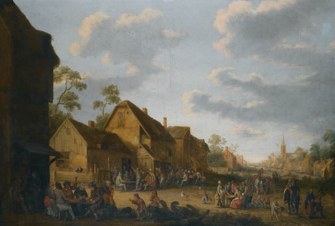 Rue de village avec des paysans faisant la fête devant une auberge